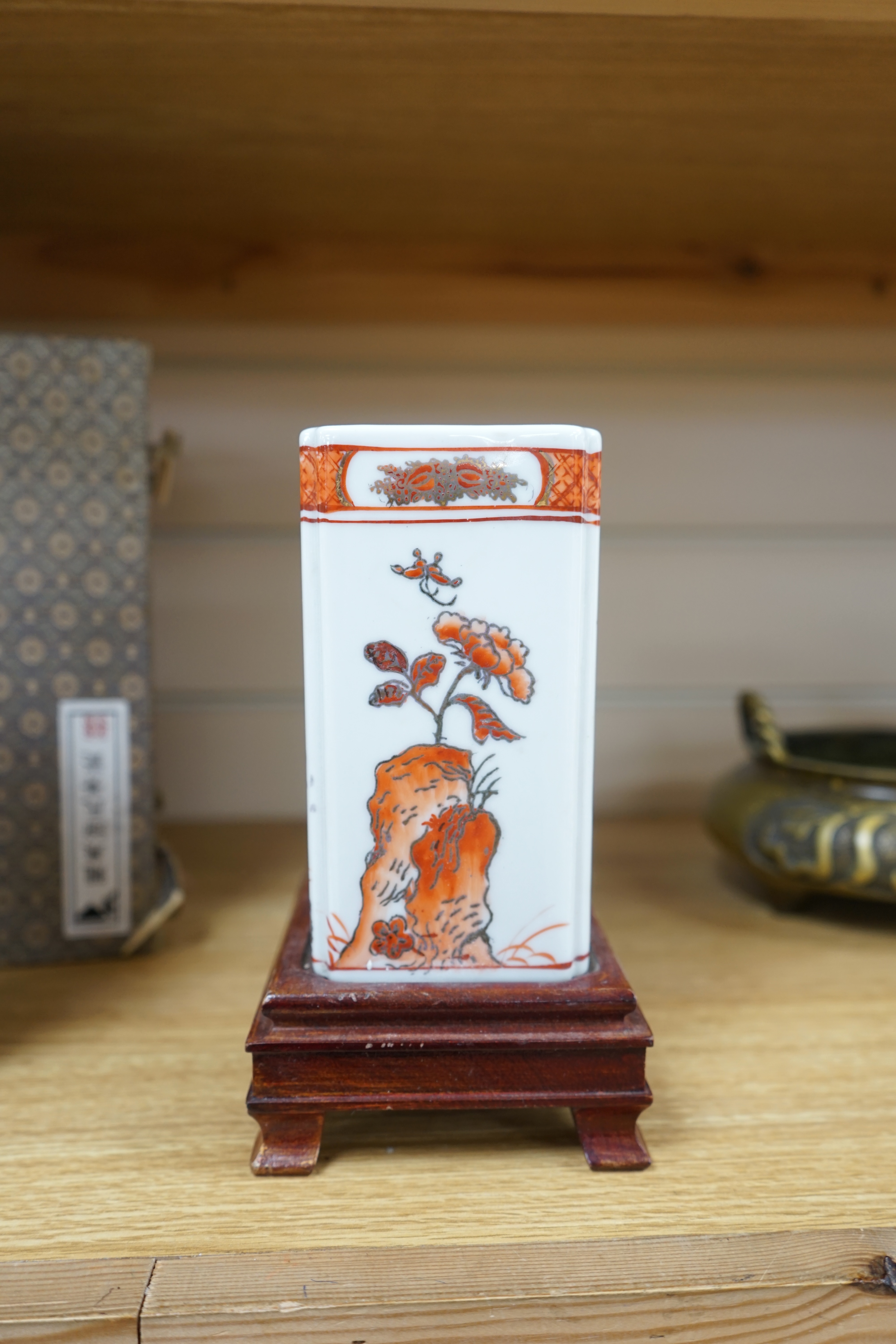 Two Chinese enamelled porcelain figure decorated vases, an underglaze blue and copper read garlic neck vase, and a rectangular jar with wood stand Condition - One vase cracked and chipped the rectangular jar lacking cove